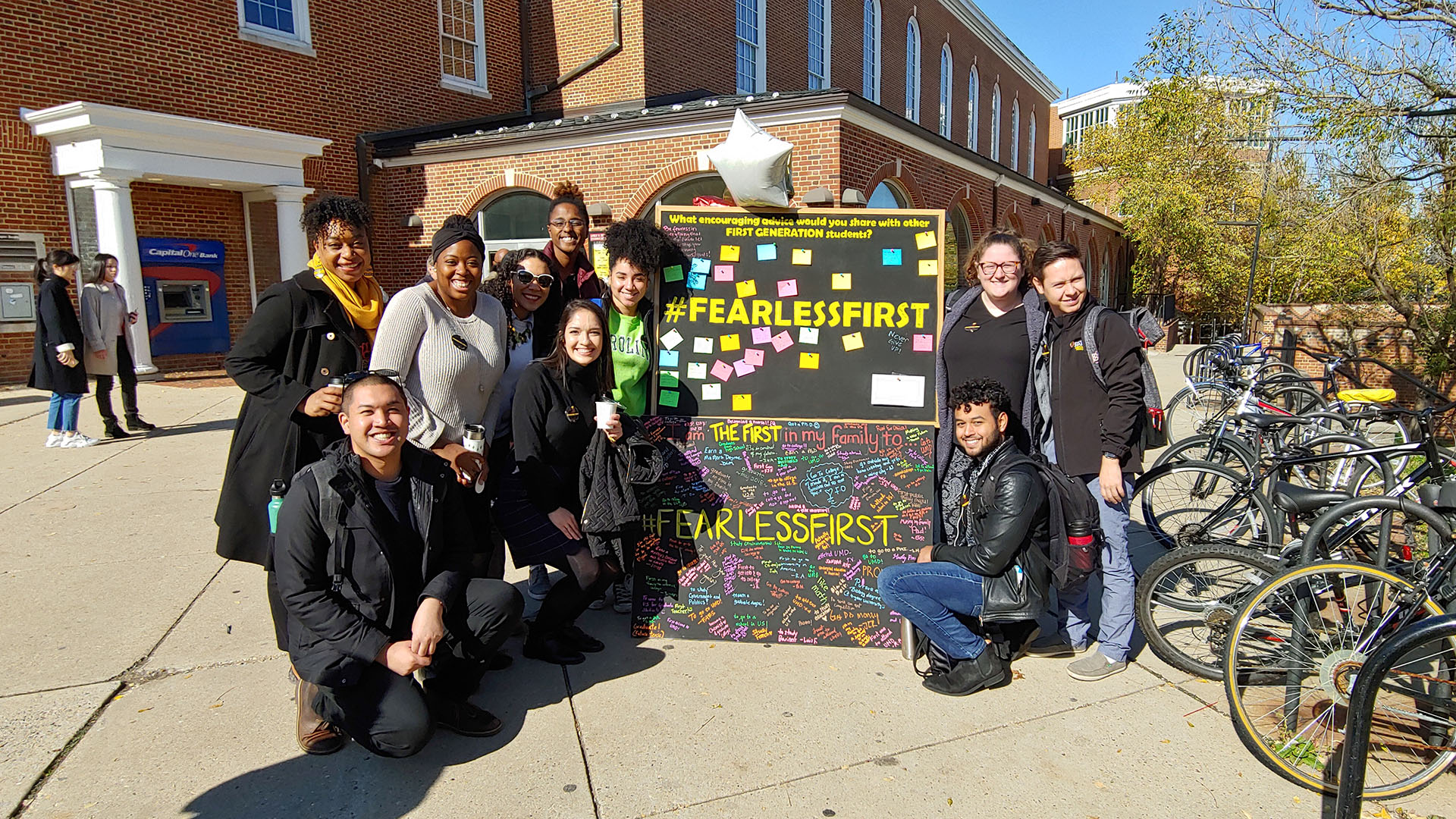 group standing at student union in front of display